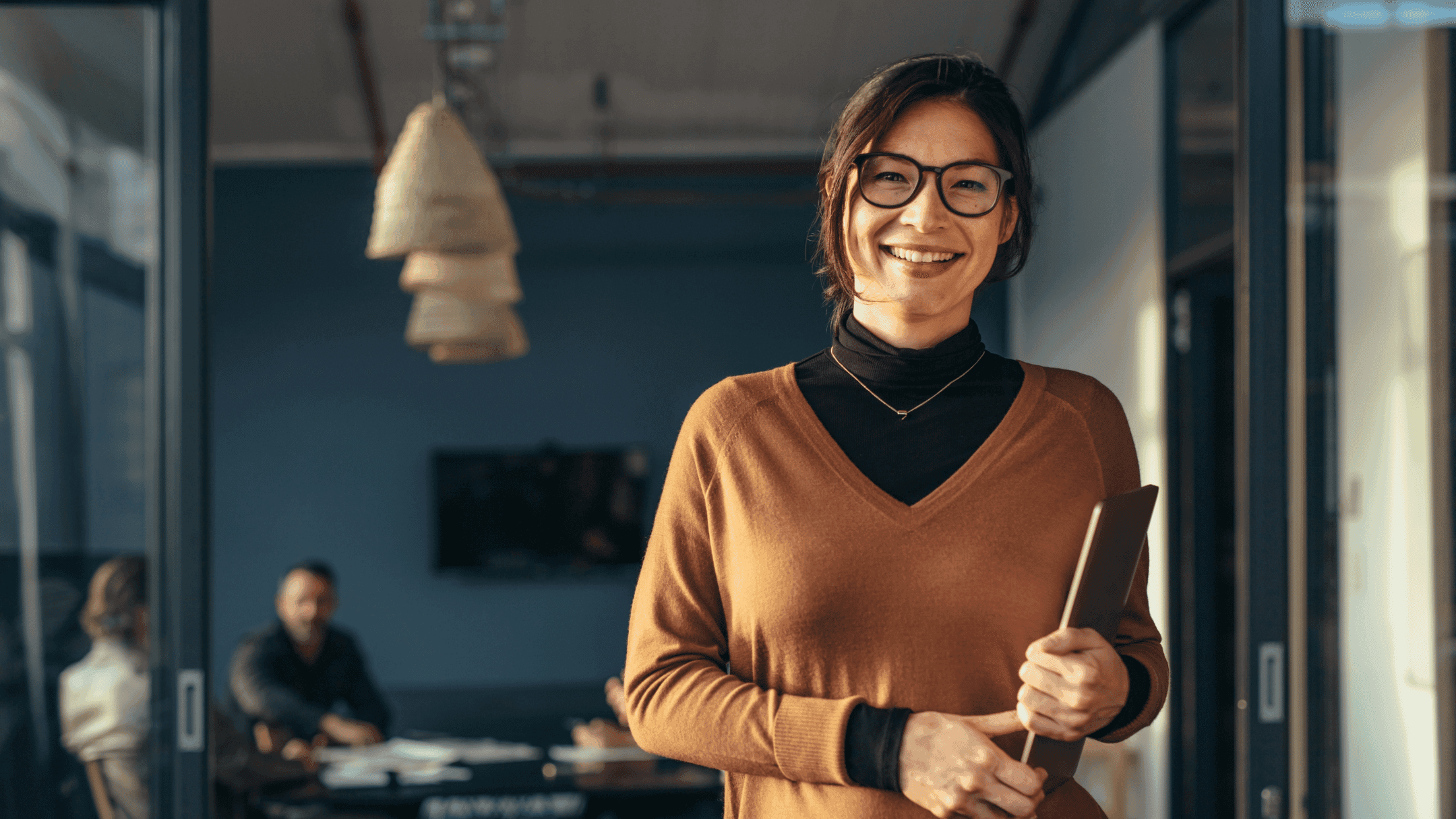 A small business owner holding a printed summary in an office, ready to share with a client